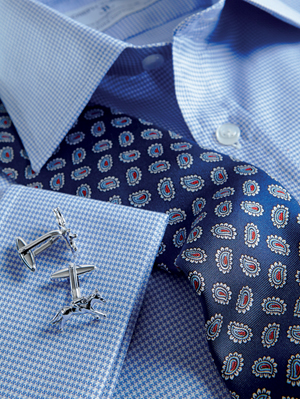 Blue formal shirt with blue patterned tie and silver cufflinks